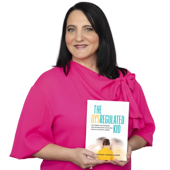 Dr. Roseann Capanna-Hodge holding her book, The Dysregulated Kid